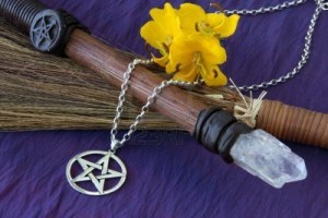 3335545-close-up-of-wiccan-objects--pentacle-pendant-wood--crystal-wand-and-straw-besom